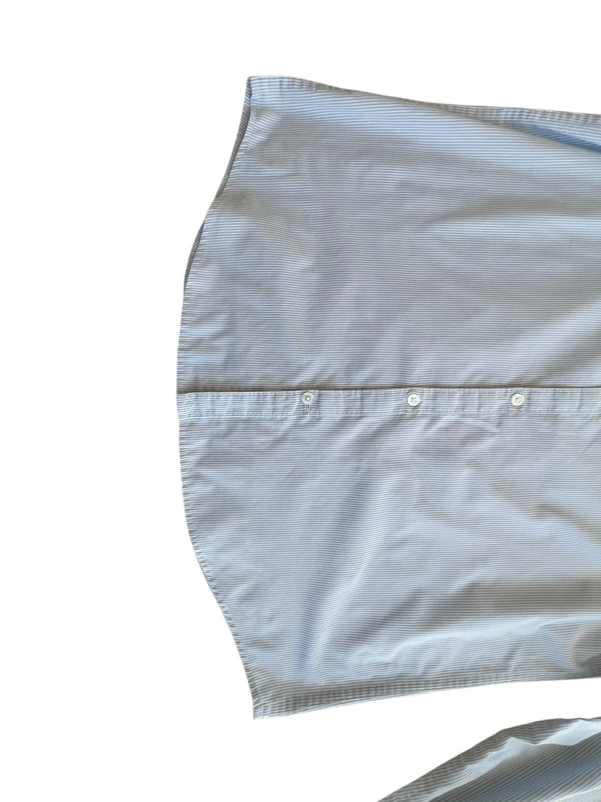 Penguin blue and white striped button down shirt with casual collar and subtle imperfections.