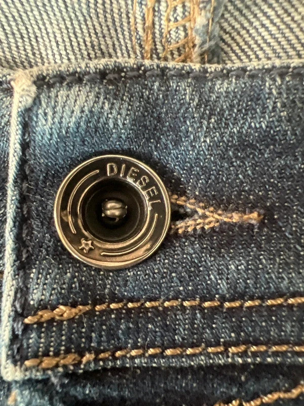 Diesel blue slim straight jeans with logo patch and classic denim texture.