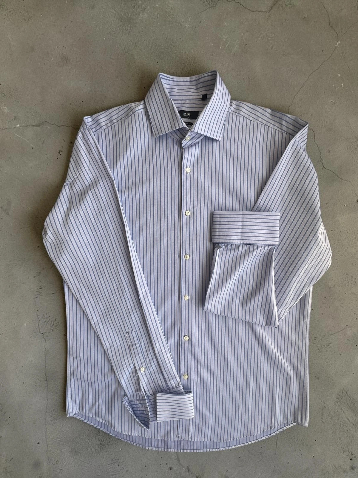 Hugo Boss blue striped formal shirt with cufflink buttons and regular fit.