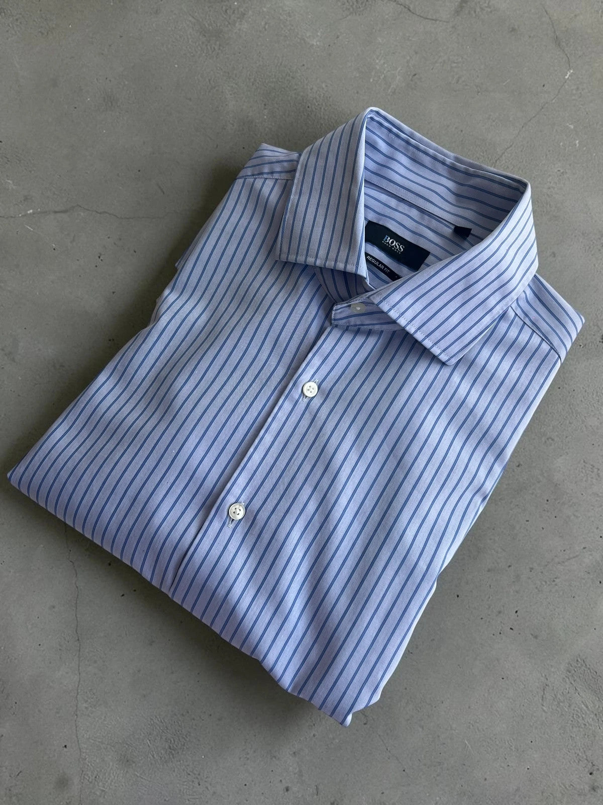 Hugo Boss blue striped formal shirt with cufflink buttons and regular fit.