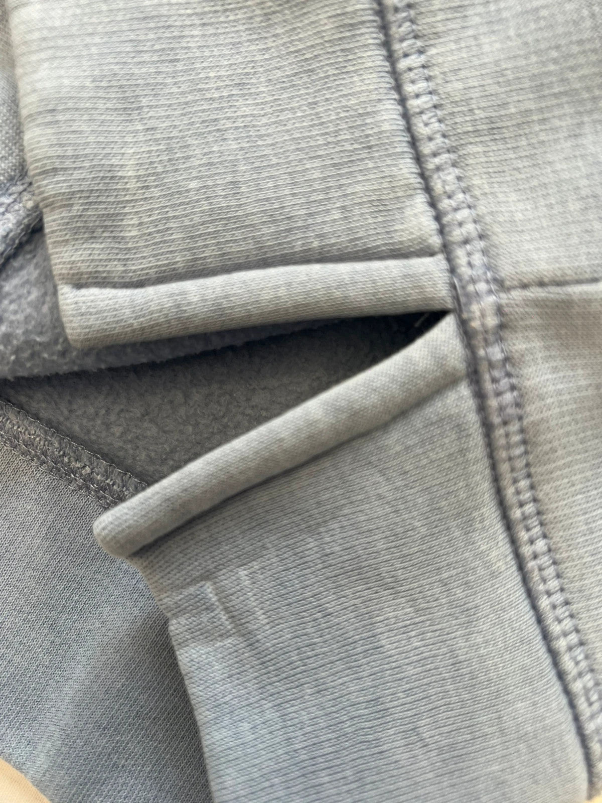 Tommy Hilfiger blue hoodie with embroidered logo and adjustable hood, soft interior.