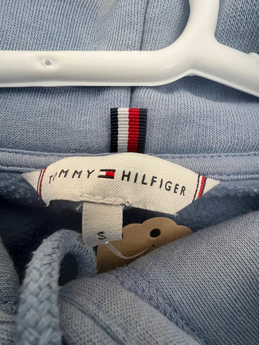 Tommy Hilfiger blue hoodie with embroidered logo and adjustable hood, soft interior.