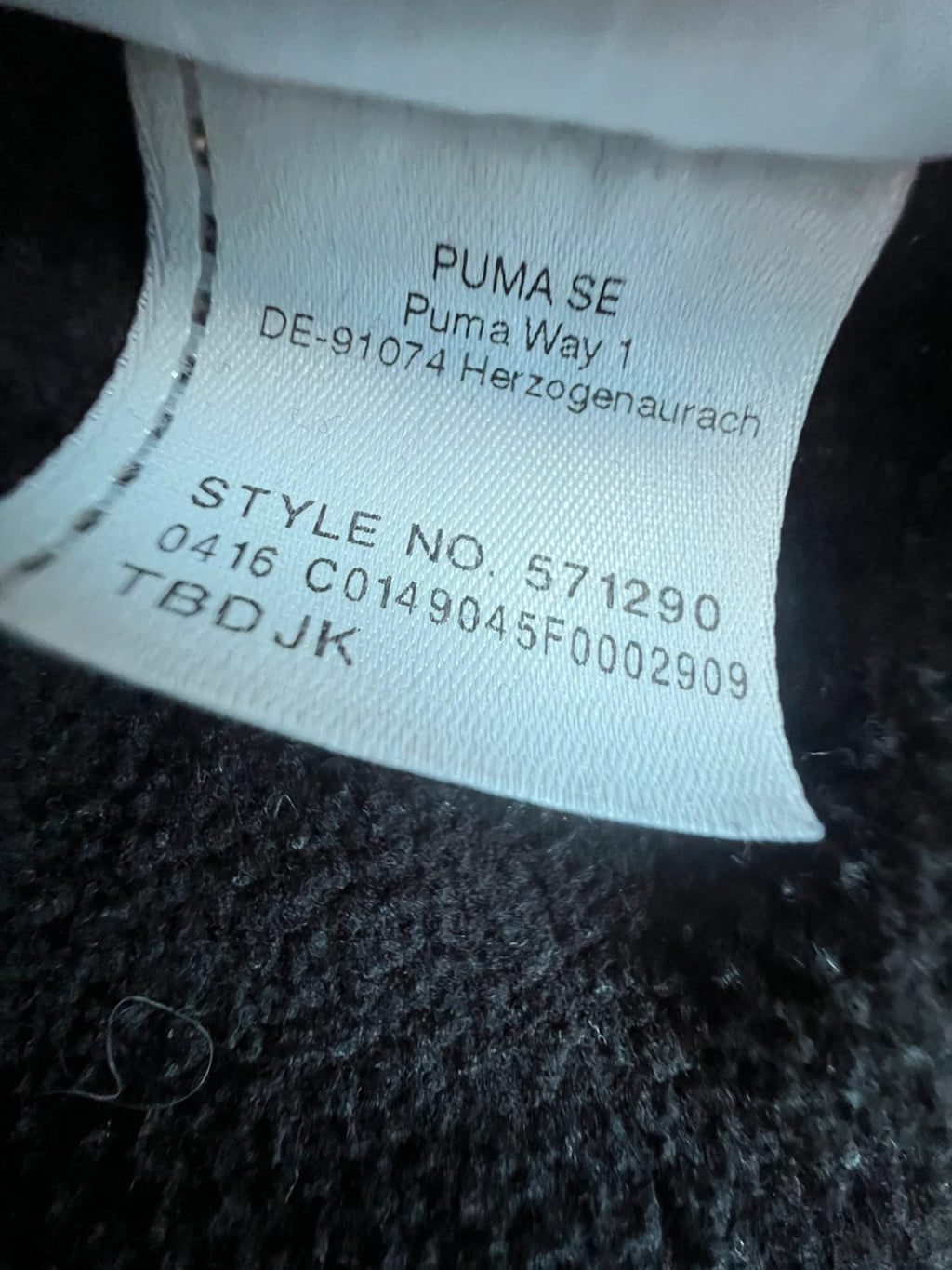 Puma black oversized hoodie with large cracked silver logo, vintage Y2K style.