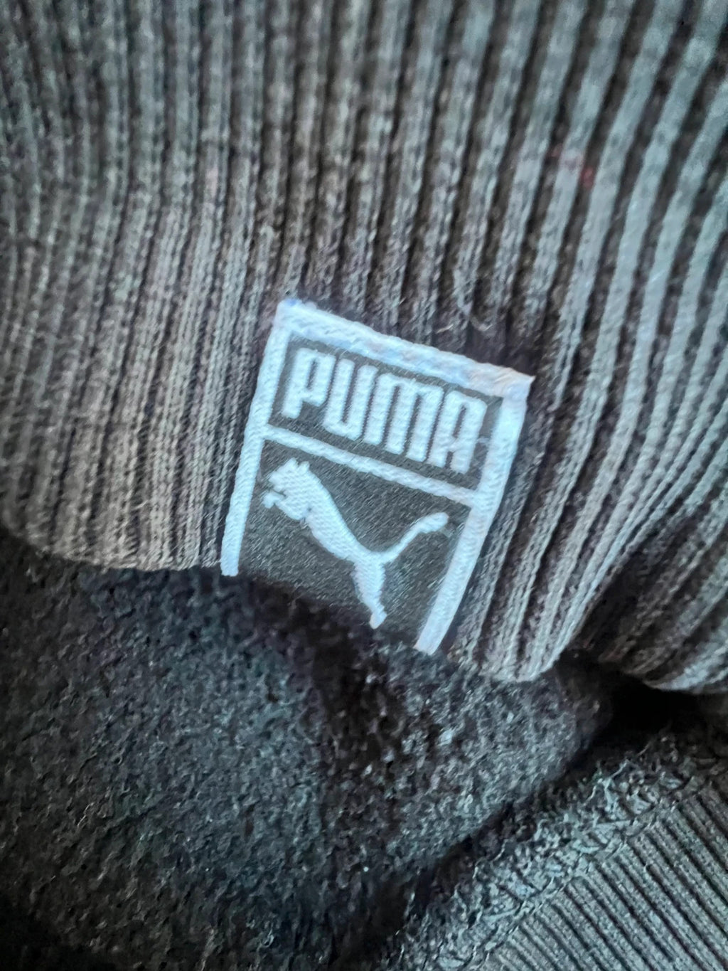 Puma black oversized hoodie with large cracked silver logo, vintage Y2K style.