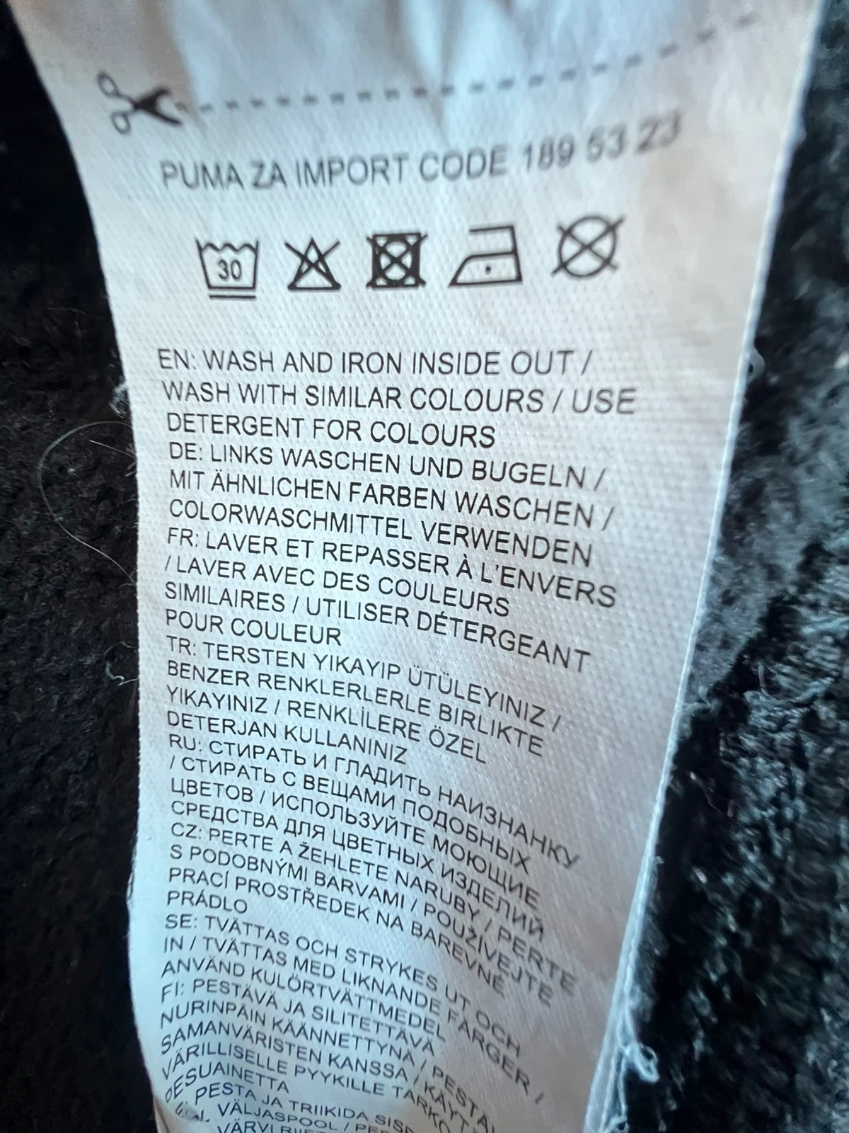 Puma black oversized hoodie with large cracked silver logo, vintage Y2K style.