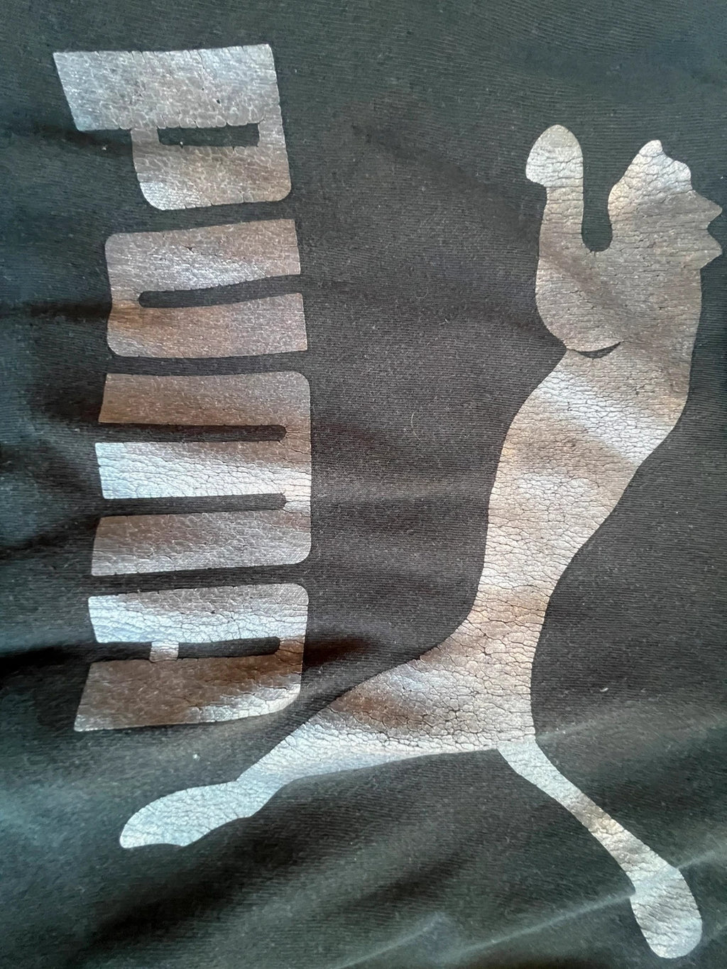 Puma black oversized hoodie with large cracked silver logo, vintage Y2K style.