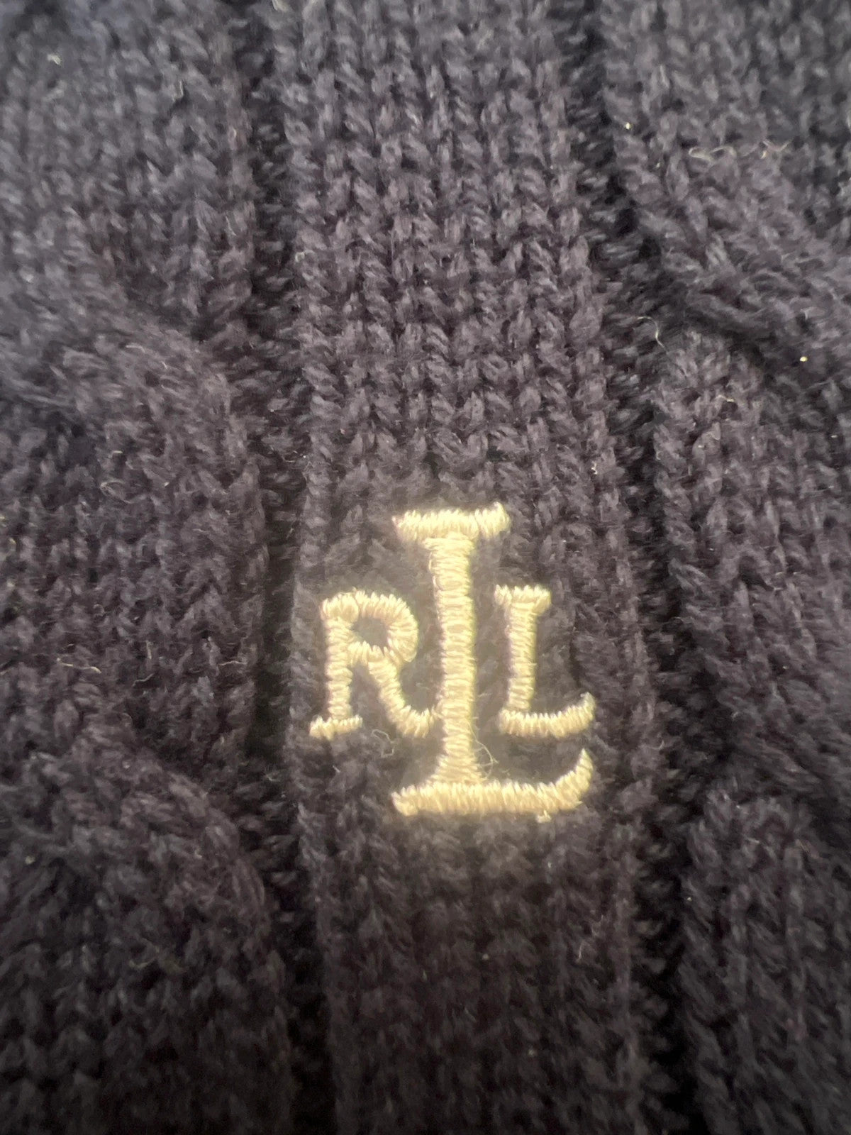 Ralph Lauren navy jumper cable knit with embroidered RL logo and V-neck.