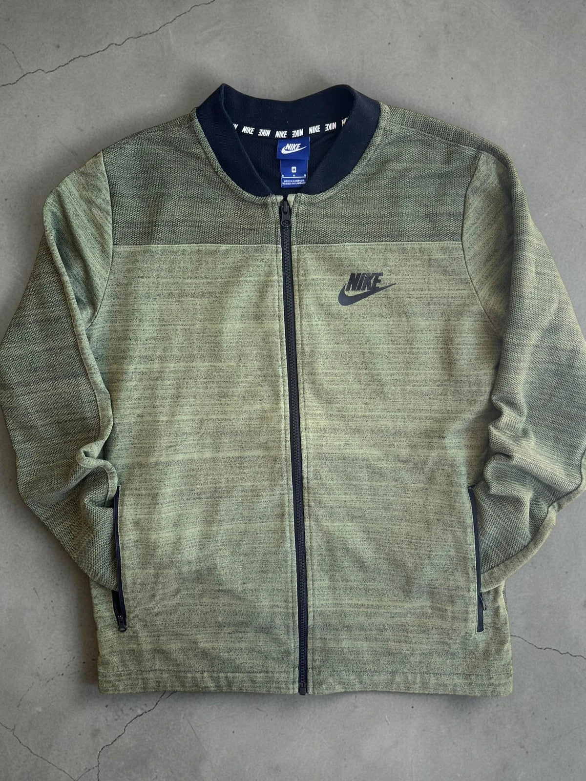 Nike green marl zip sweatshirt jacket with black logo and side zip pockets.
