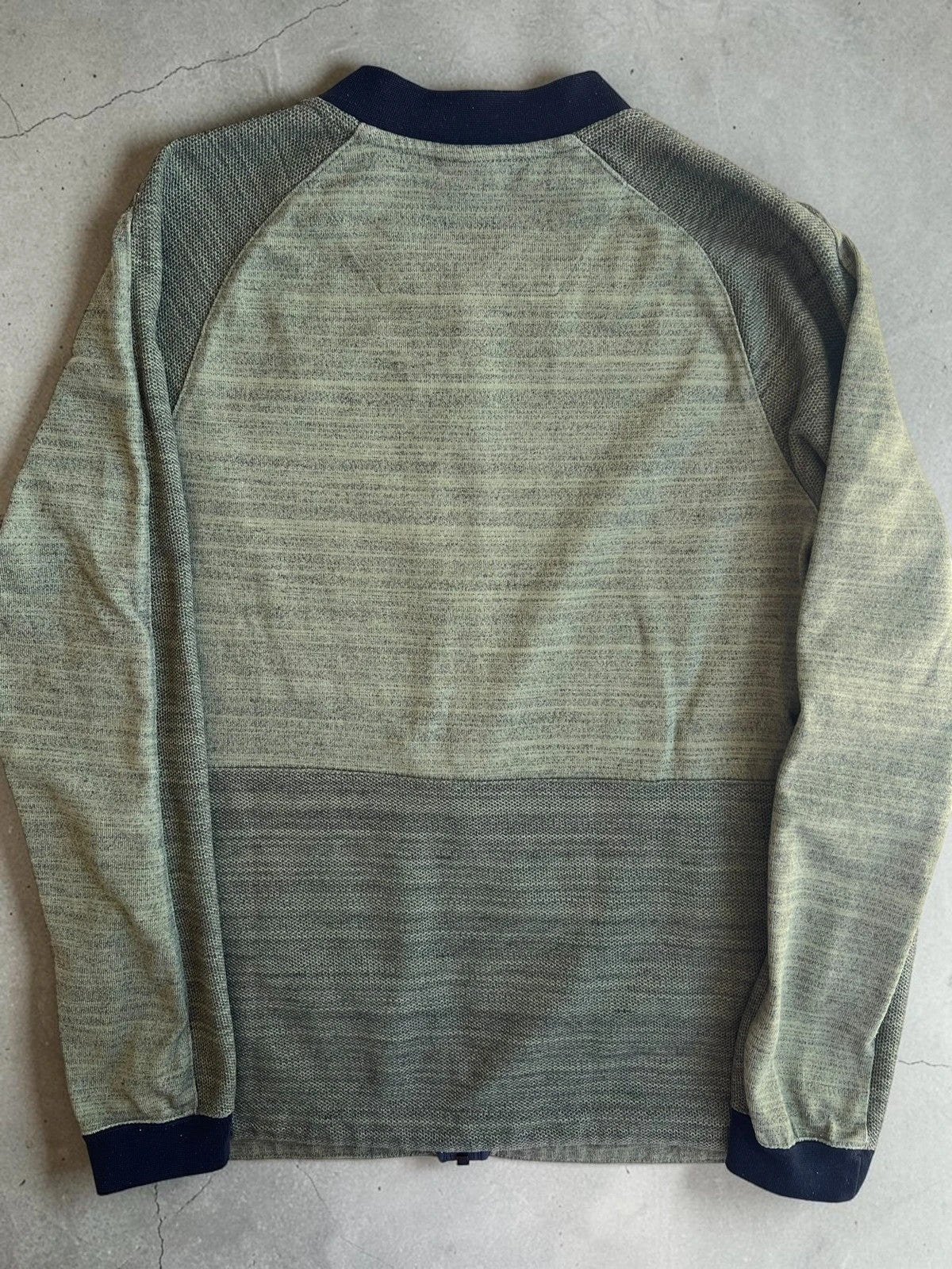 Nike green marl zip sweatshirt jacket with black logo and side zip pockets.