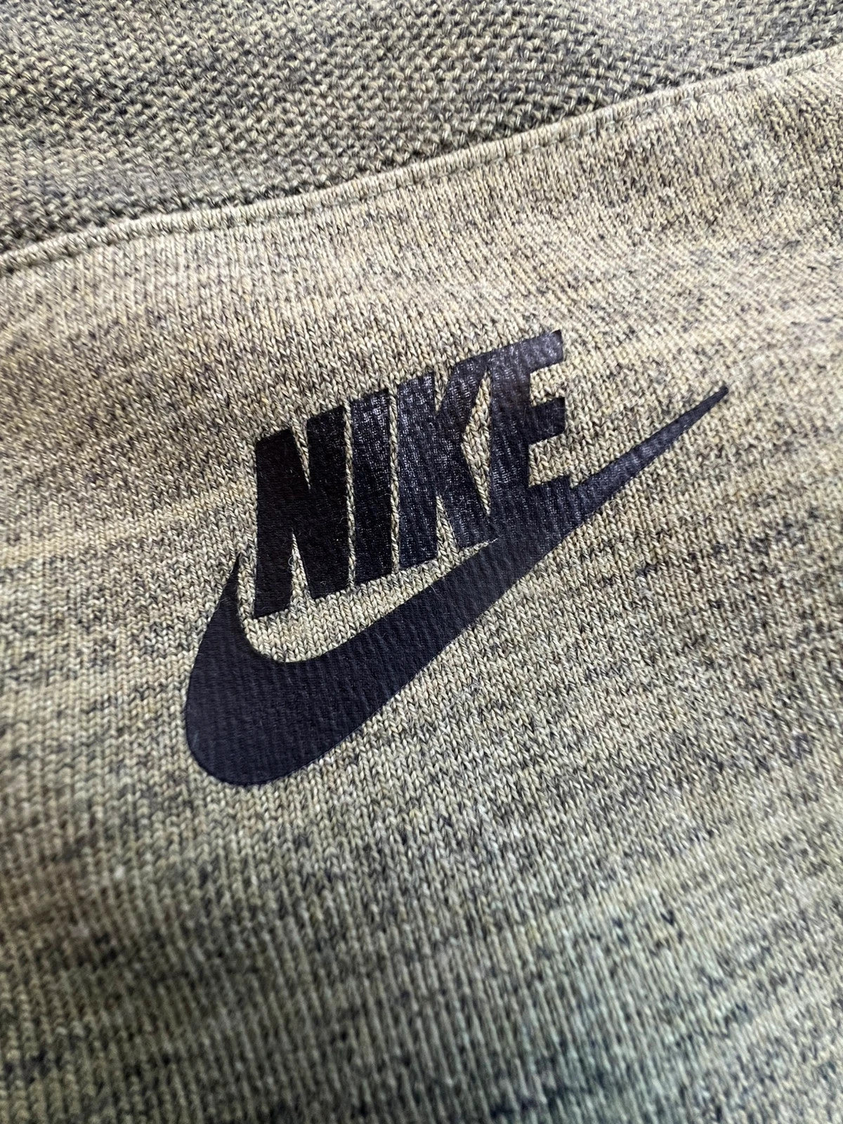 Nike green marl zip sweatshirt jacket with black logo and side zip pockets.