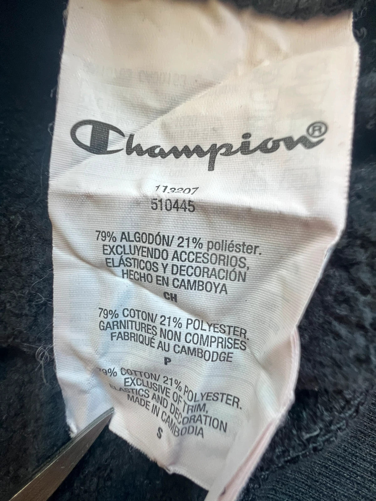 Champion black hoodie large spell out logo front, kangaroo pocket, fleece interior.