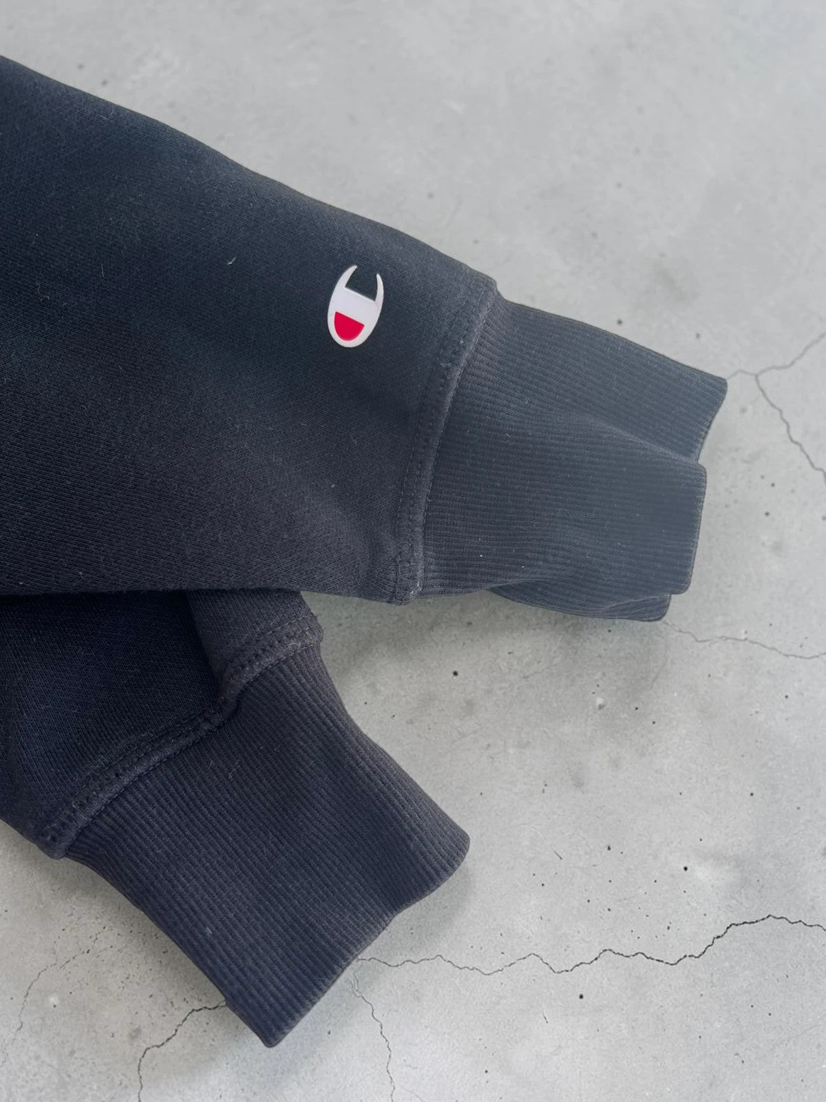 Champion black hoodie large spell out logo front, kangaroo pocket, fleece interior.