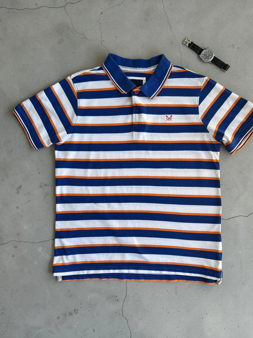 CCC men's polo shirt blue and white striped with orange accents, 100% cotton.