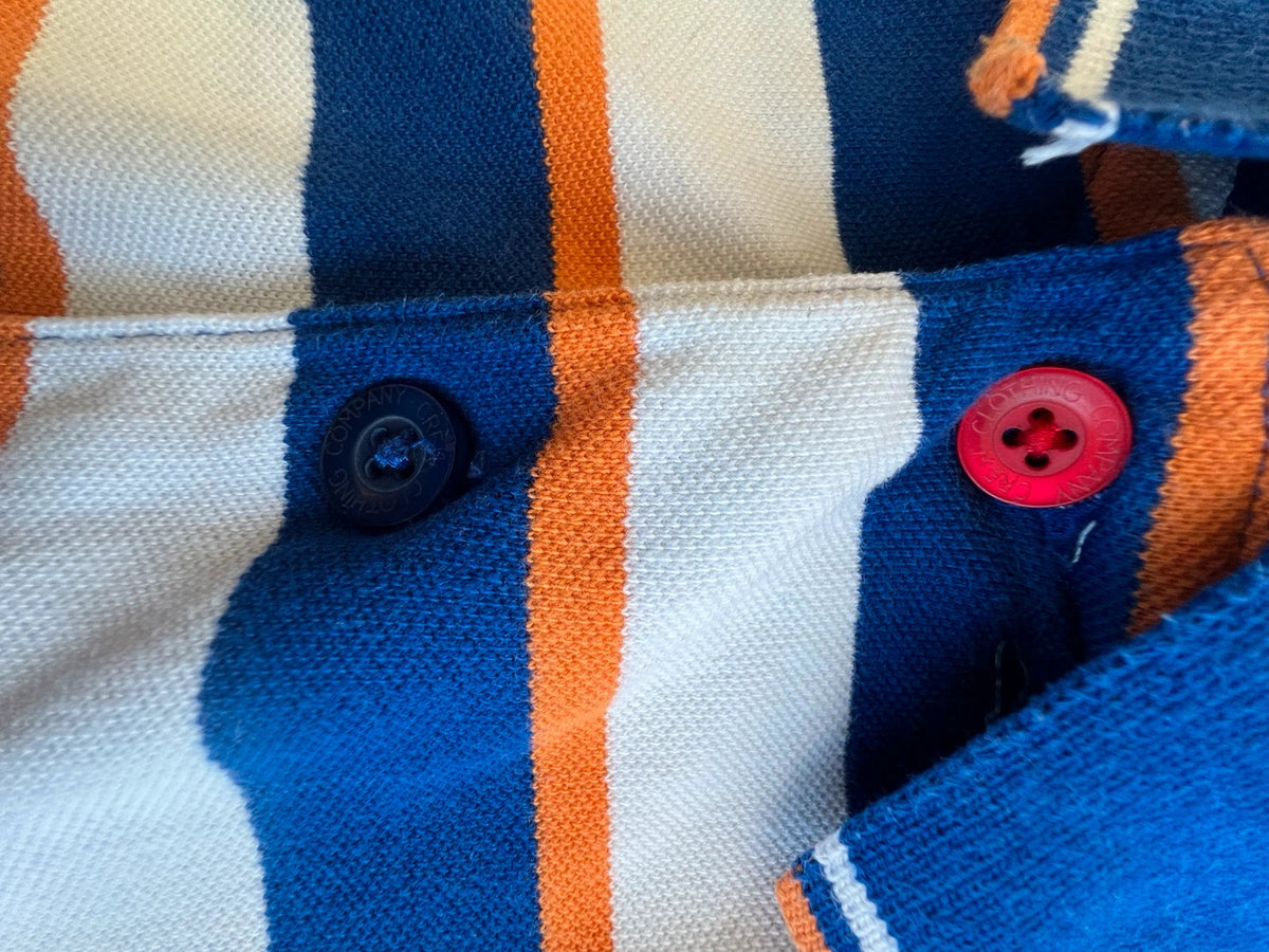 CCC men's polo shirt blue and white striped with orange accents, 100% cotton.