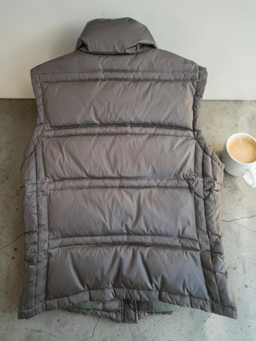Calvin Klein brown puffer vest with duck down filling and logo detail.