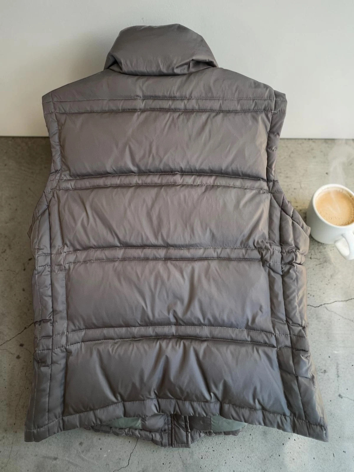 Calvin Klein brown puffer vest with duck down filling and logo detail.