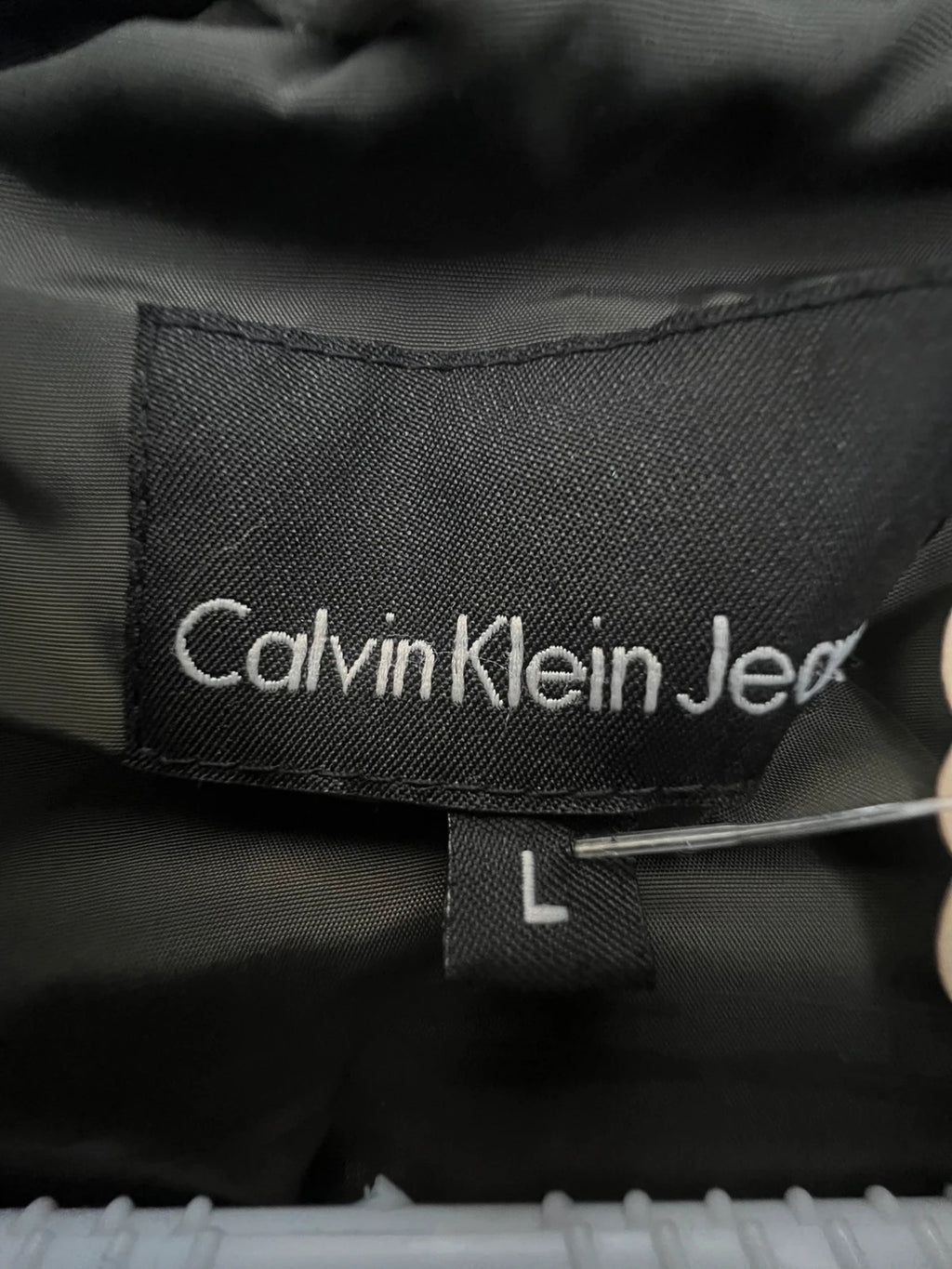 Calvin Klein brown puffer vest with duck down filling and logo detail.