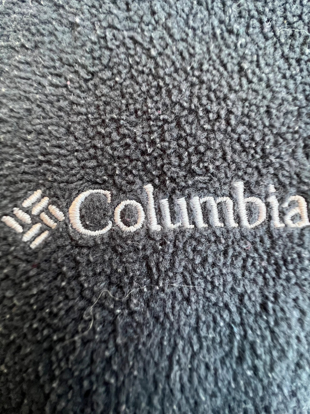 Columbia grey fleece vest with zip pockets and full front closure.
