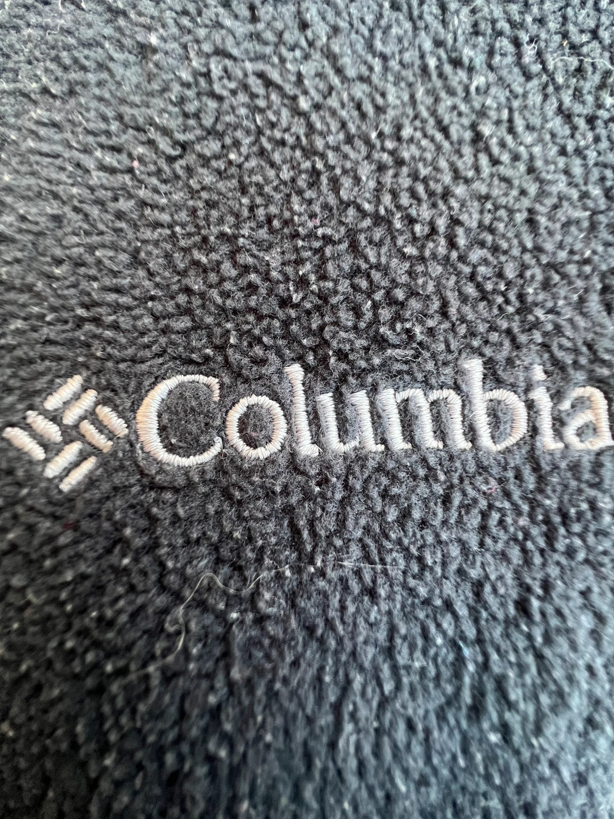 Columbia grey fleece vest with zip pockets and full front closure.