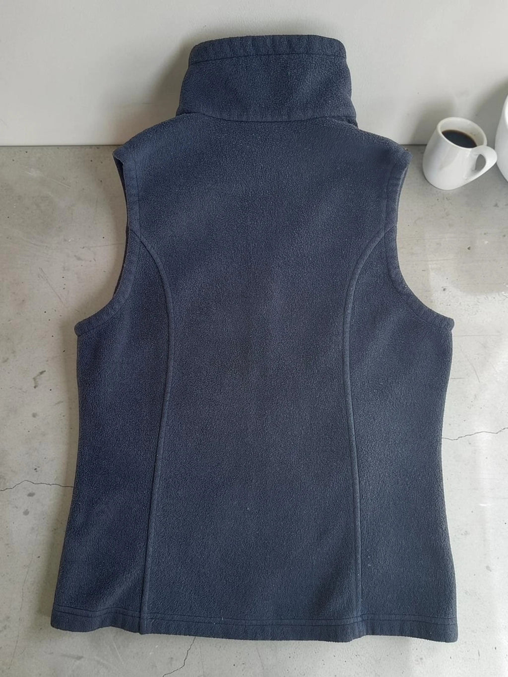 Columbia grey fleece vest with zip pockets and full front closure.