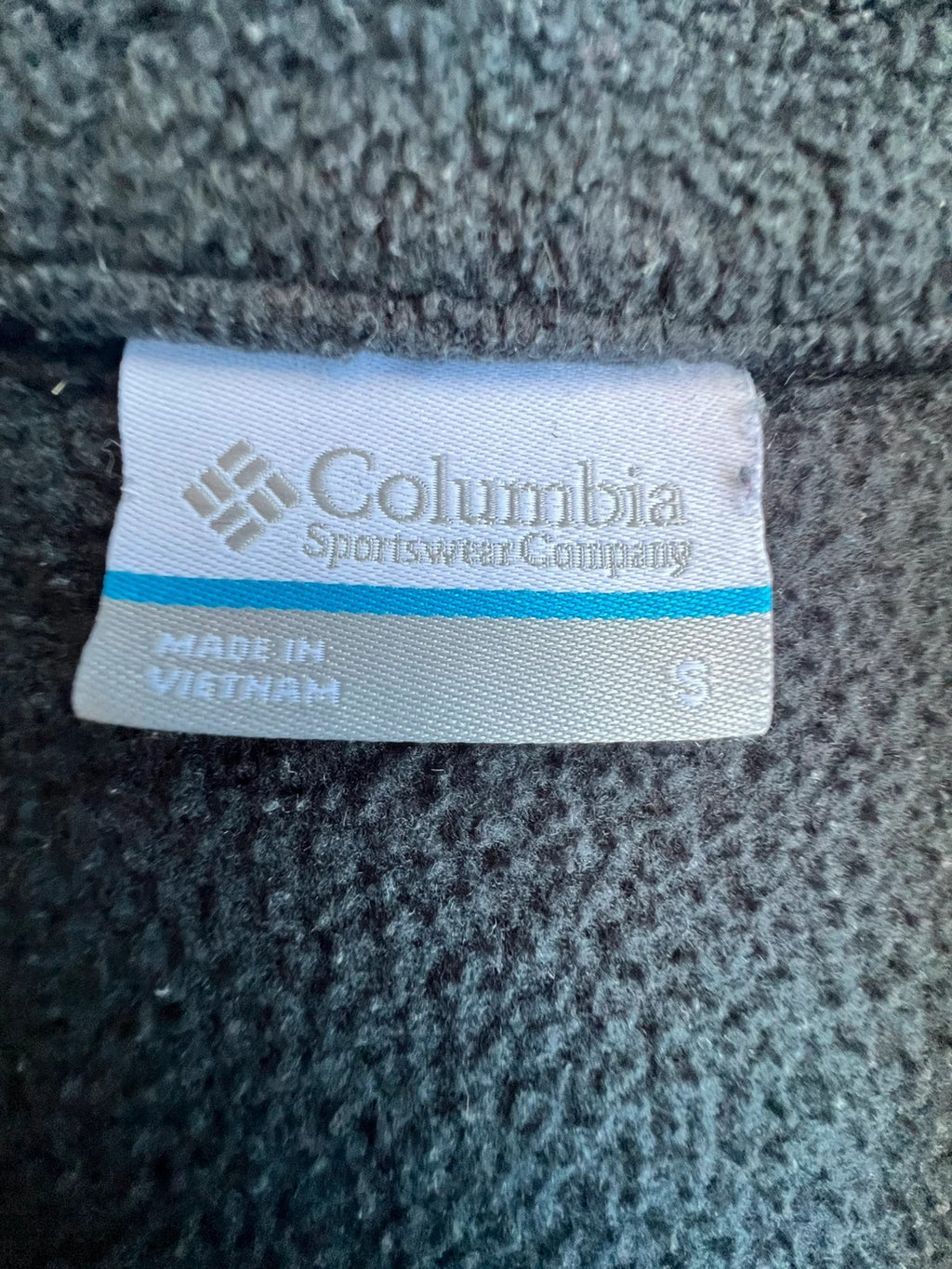 Columbia grey fleece vest with zip pockets and full front closure.