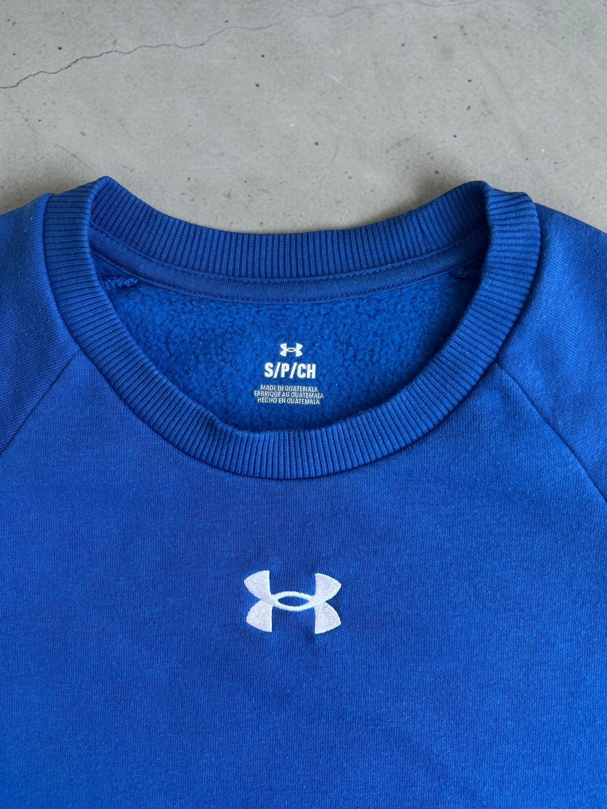 Under Armour blue fleece sweatshirt with embroidered logo, size S, casual gym wear.