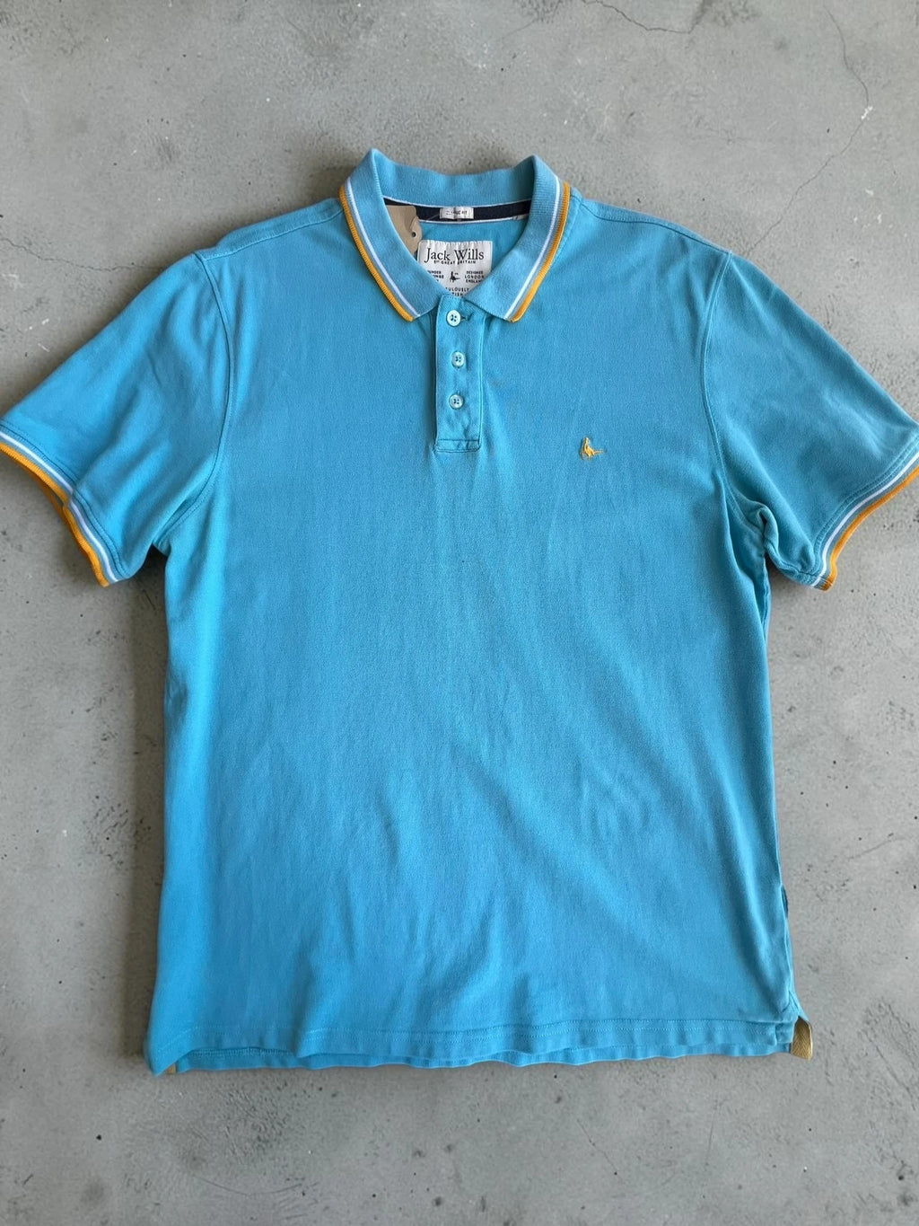Jack Wills blue polo shirt with yellow collar and sleeve details, classic fit cotton.