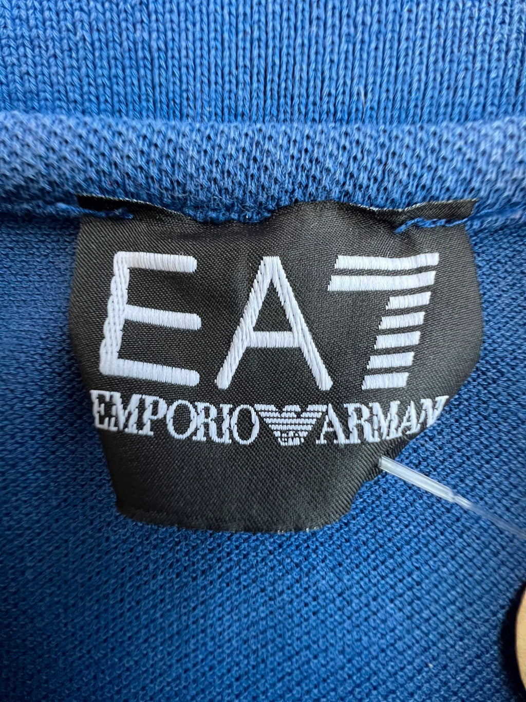 EA7 Emporio Armani blue polo shirt with embroidered logo and classic sporty design.
