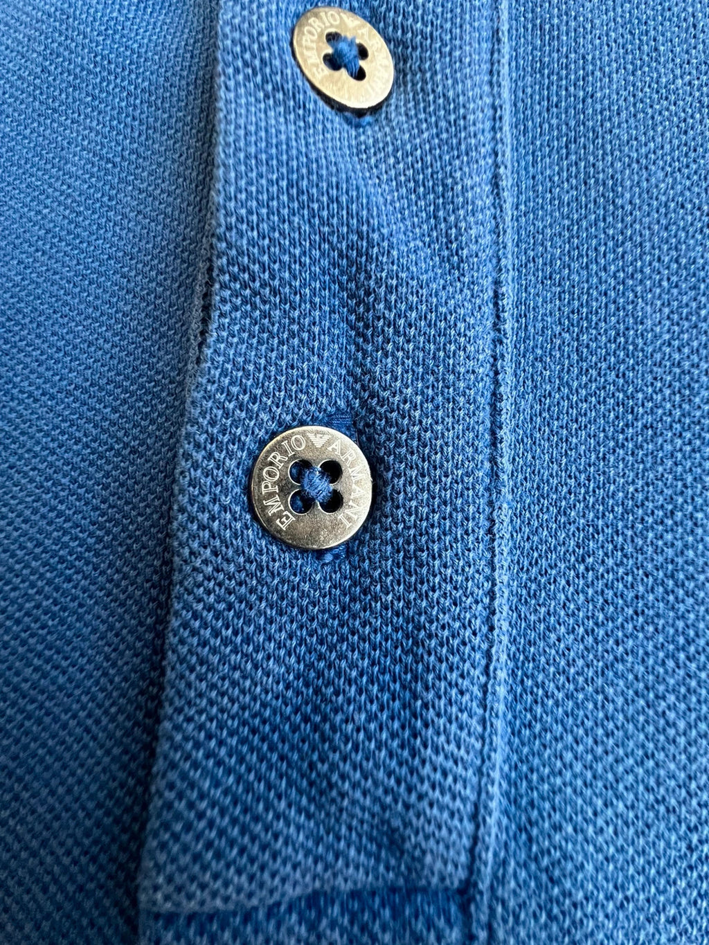 EA7 Emporio Armani blue polo shirt with embroidered logo and classic sporty design.
