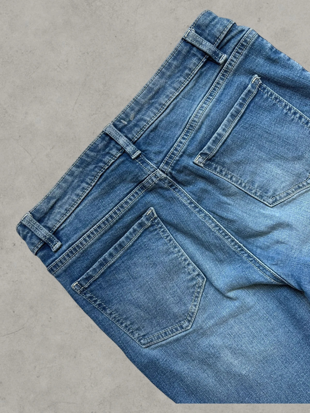 Rainbow blue straight jeans Y2K flare bootcut with decorative front buttons.