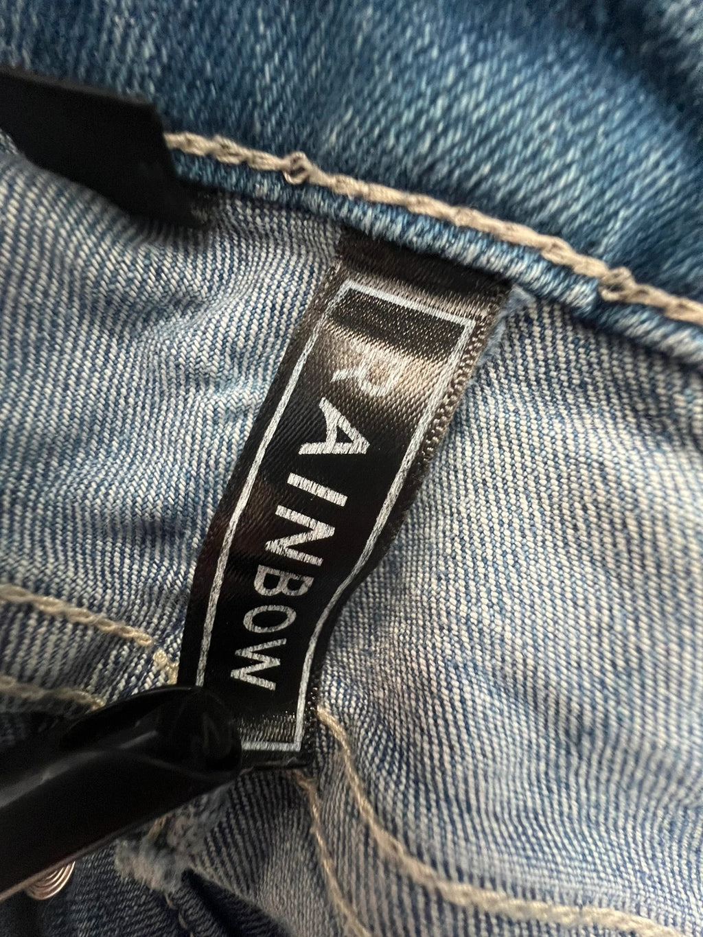 Rainbow blue straight jeans Y2K flare bootcut with decorative front buttons.