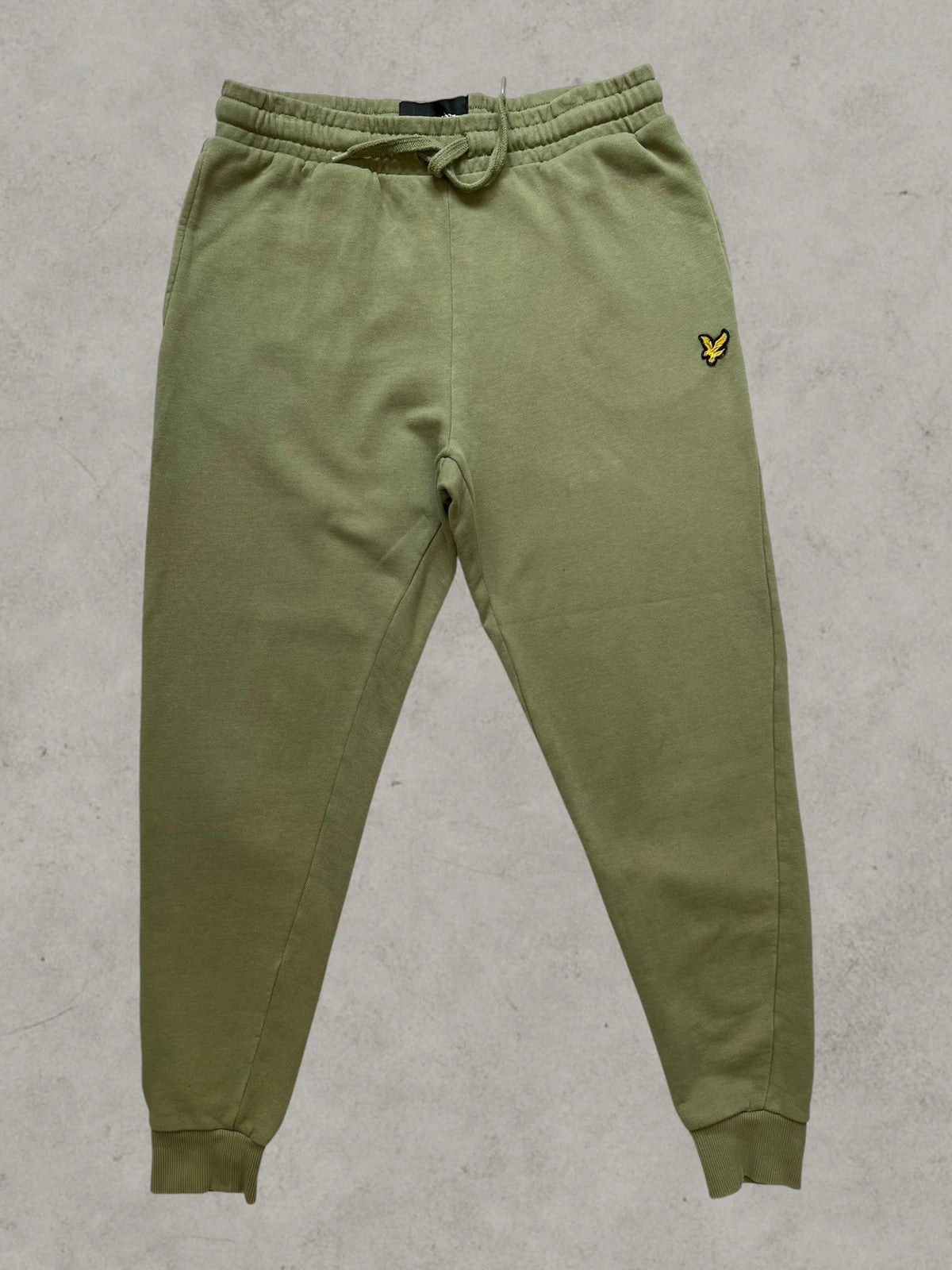 Lyle & Scott khaki joggers with embroidered eagle logo and adjustable waistband.
