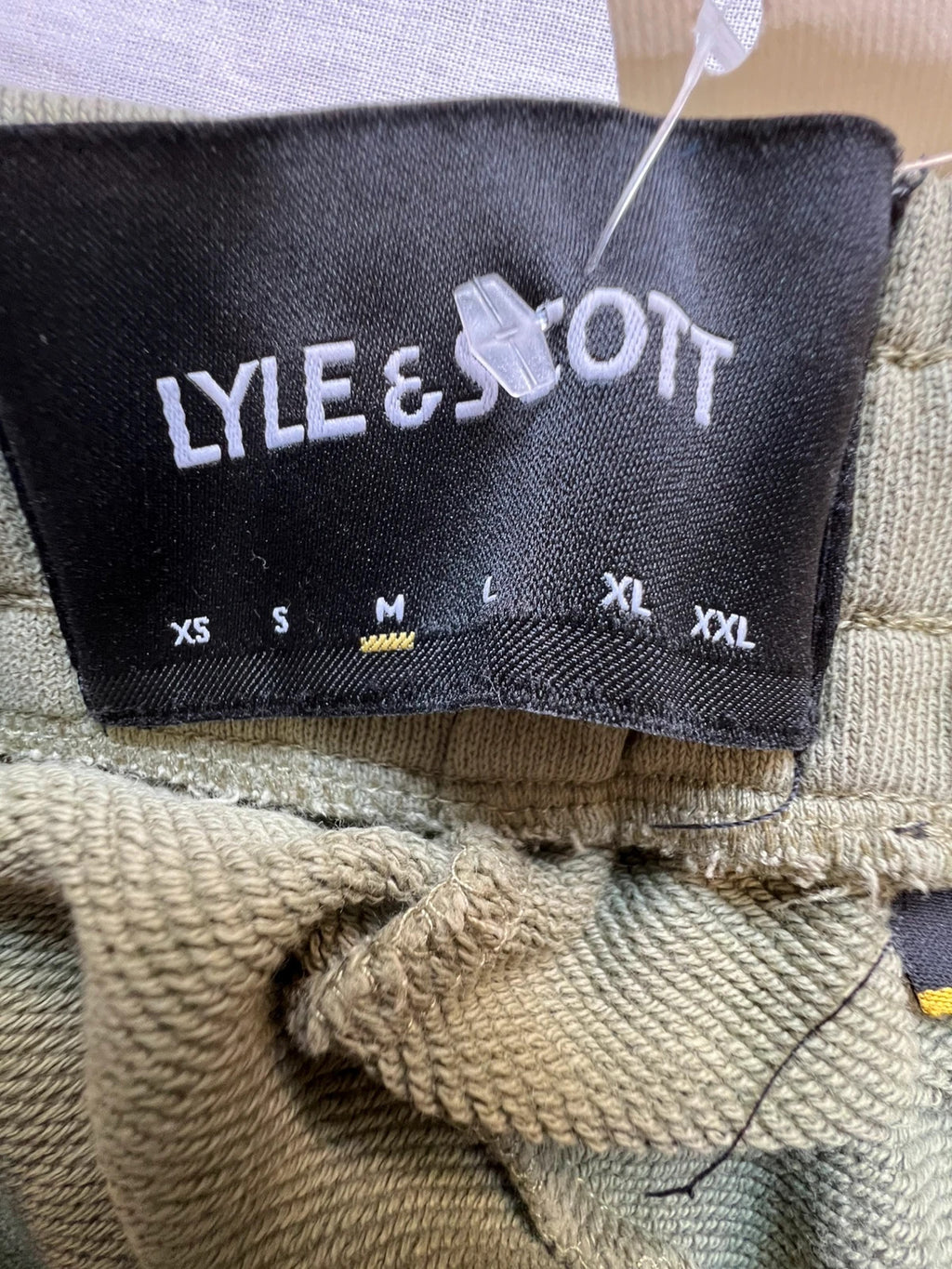 Lyle & Scott khaki joggers with embroidered eagle logo and adjustable waistband.