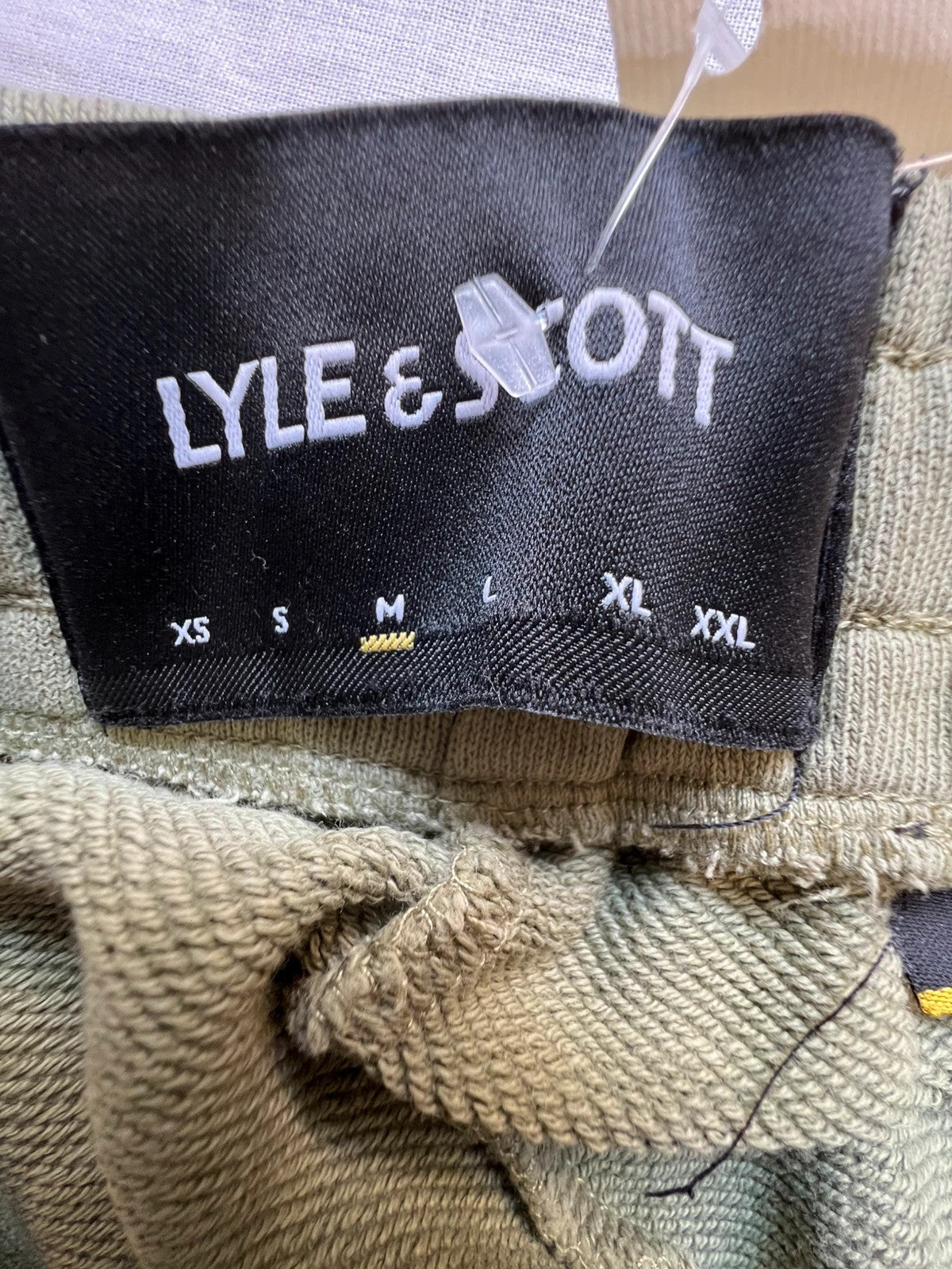 Lyle & Scott khaki joggers with embroidered eagle logo and adjustable waistband.