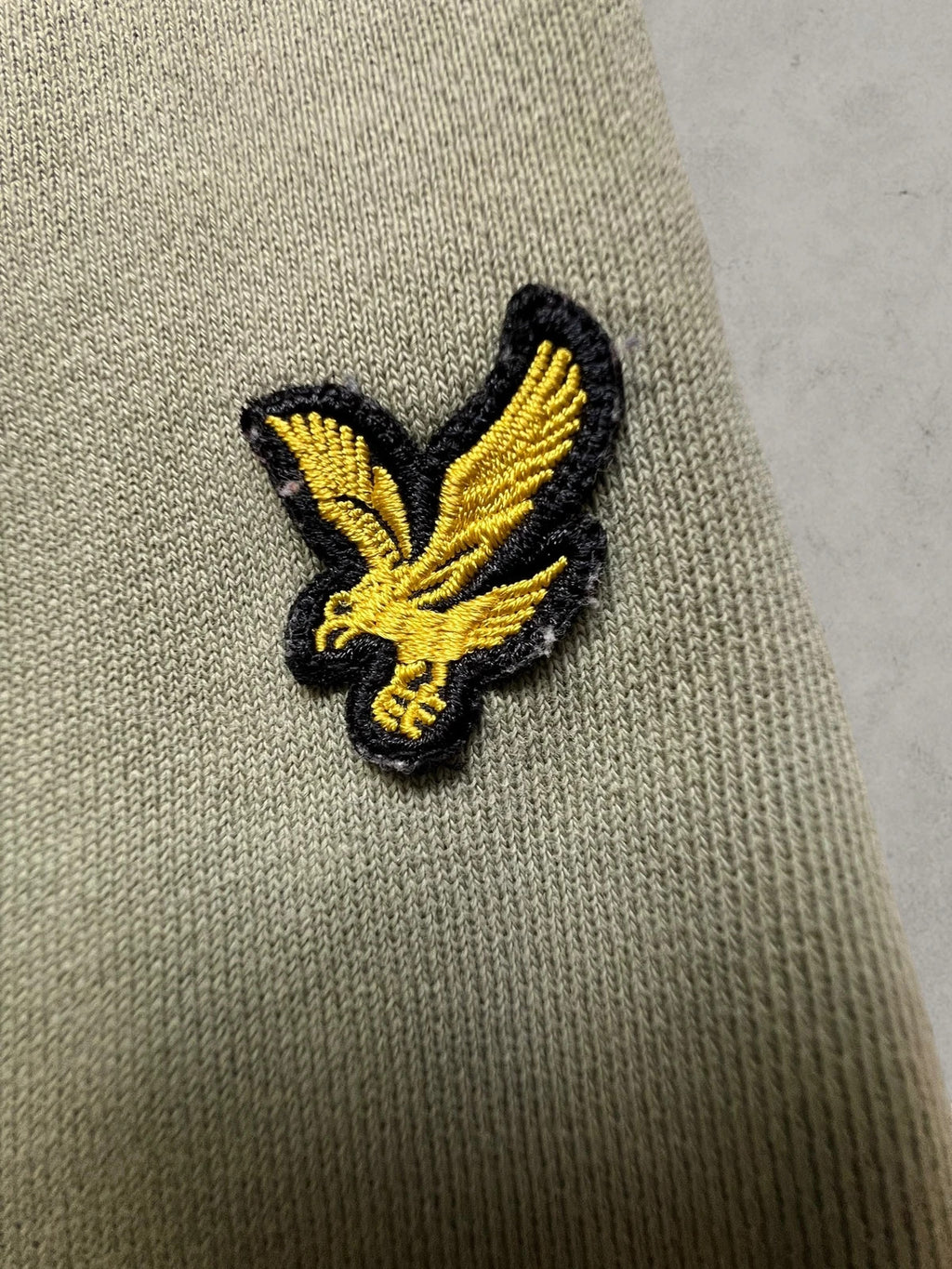 Lyle & Scott khaki joggers with embroidered eagle logo and adjustable waistband.