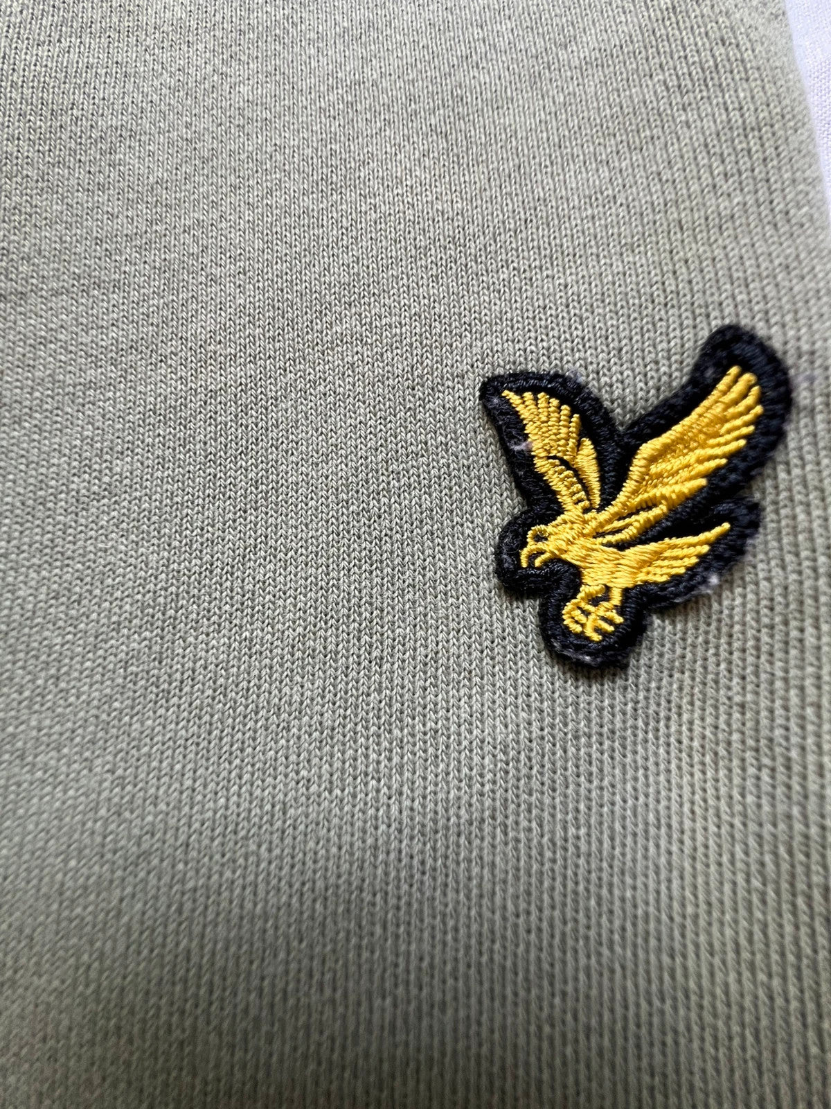 Lyle & Scott khaki joggers with embroidered eagle logo and adjustable waistband.