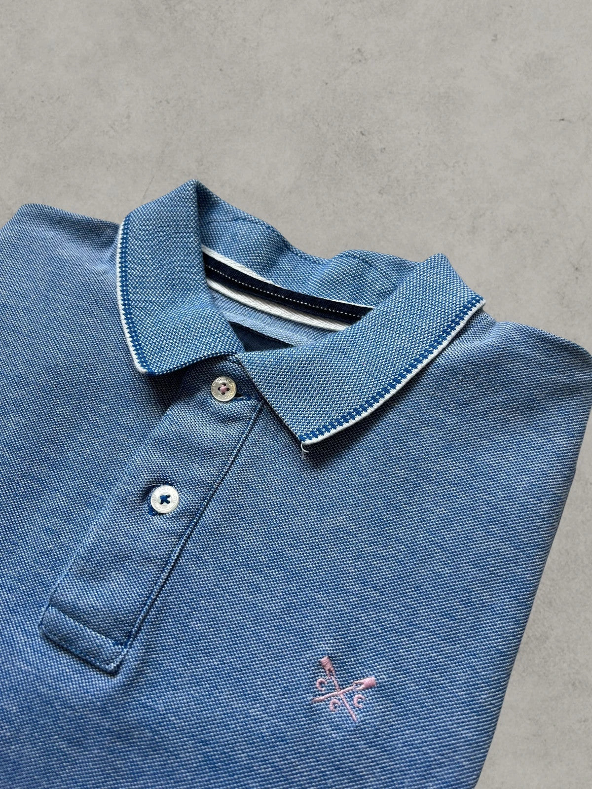 Crew Clothing Company blue polo shirt with embroidered logo and classic piqué fabric.
