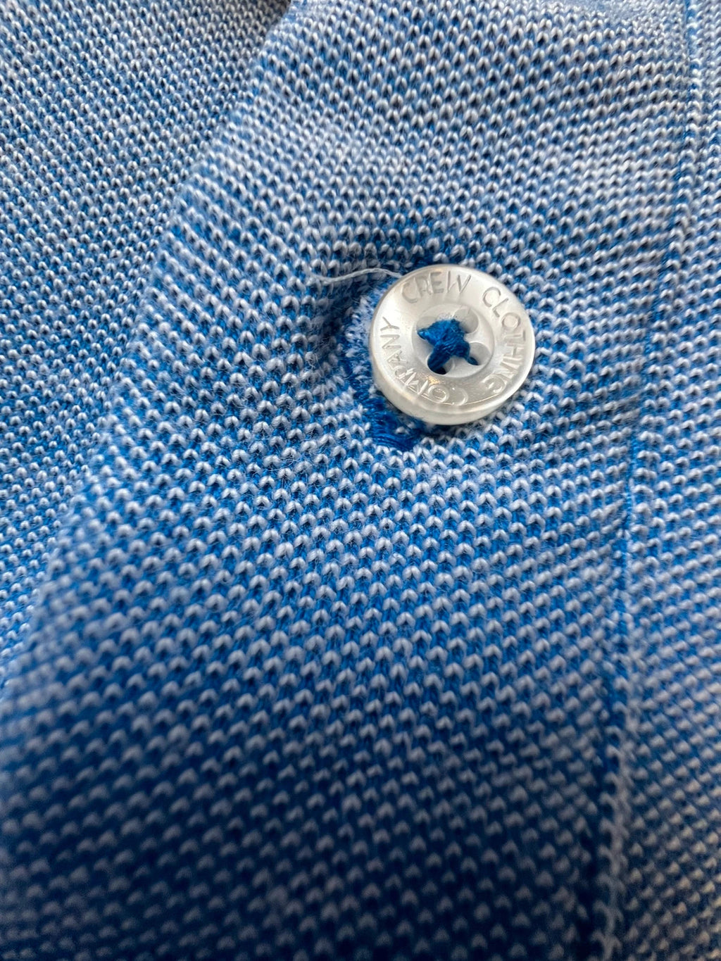 Crew Clothing Company blue polo shirt with embroidered logo and classic piqué fabric.