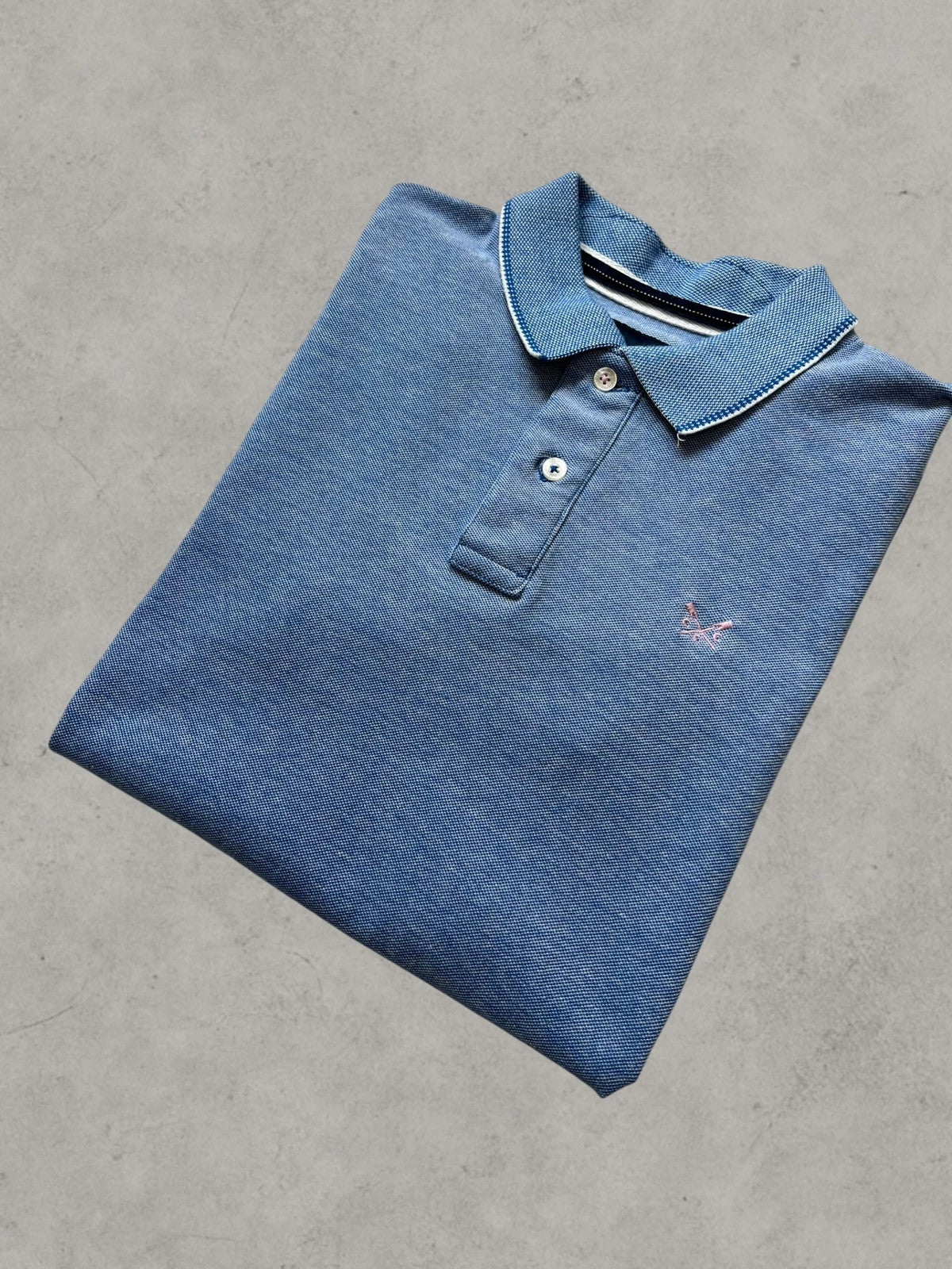 Crew Clothing Company blue polo shirt with embroidered logo and classic piqué fabric.