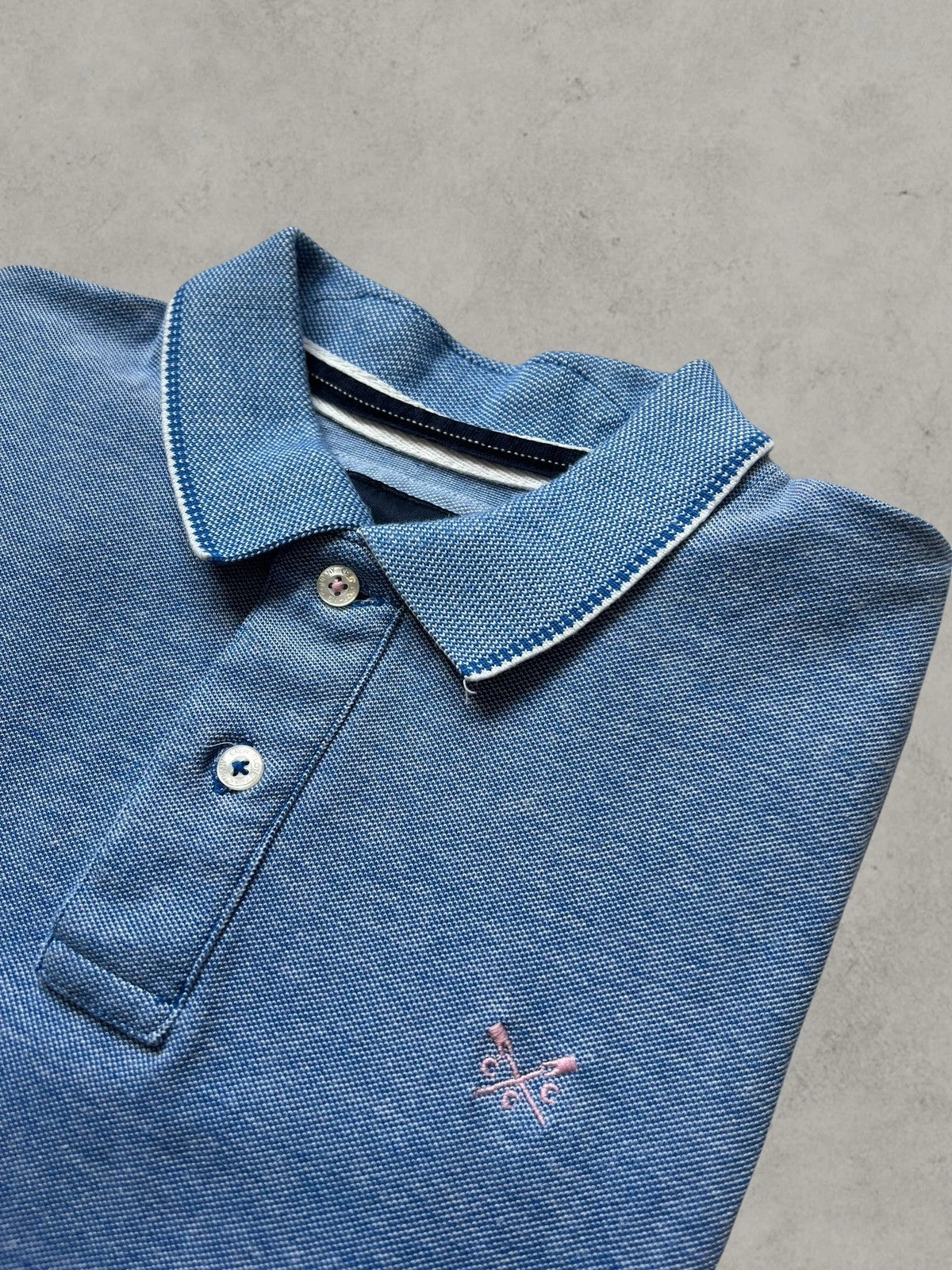 Crew Clothing Company blue polo shirt with embroidered logo and classic piqué fabric.