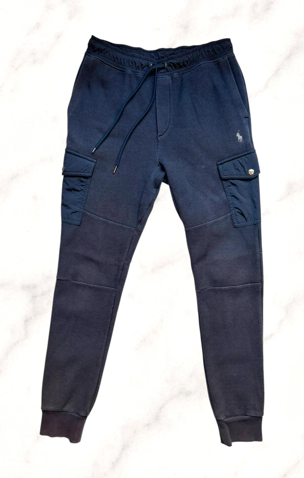 Polo Ralph Lauren navy joggers with embroidered Pony logo and side cargo pockets.