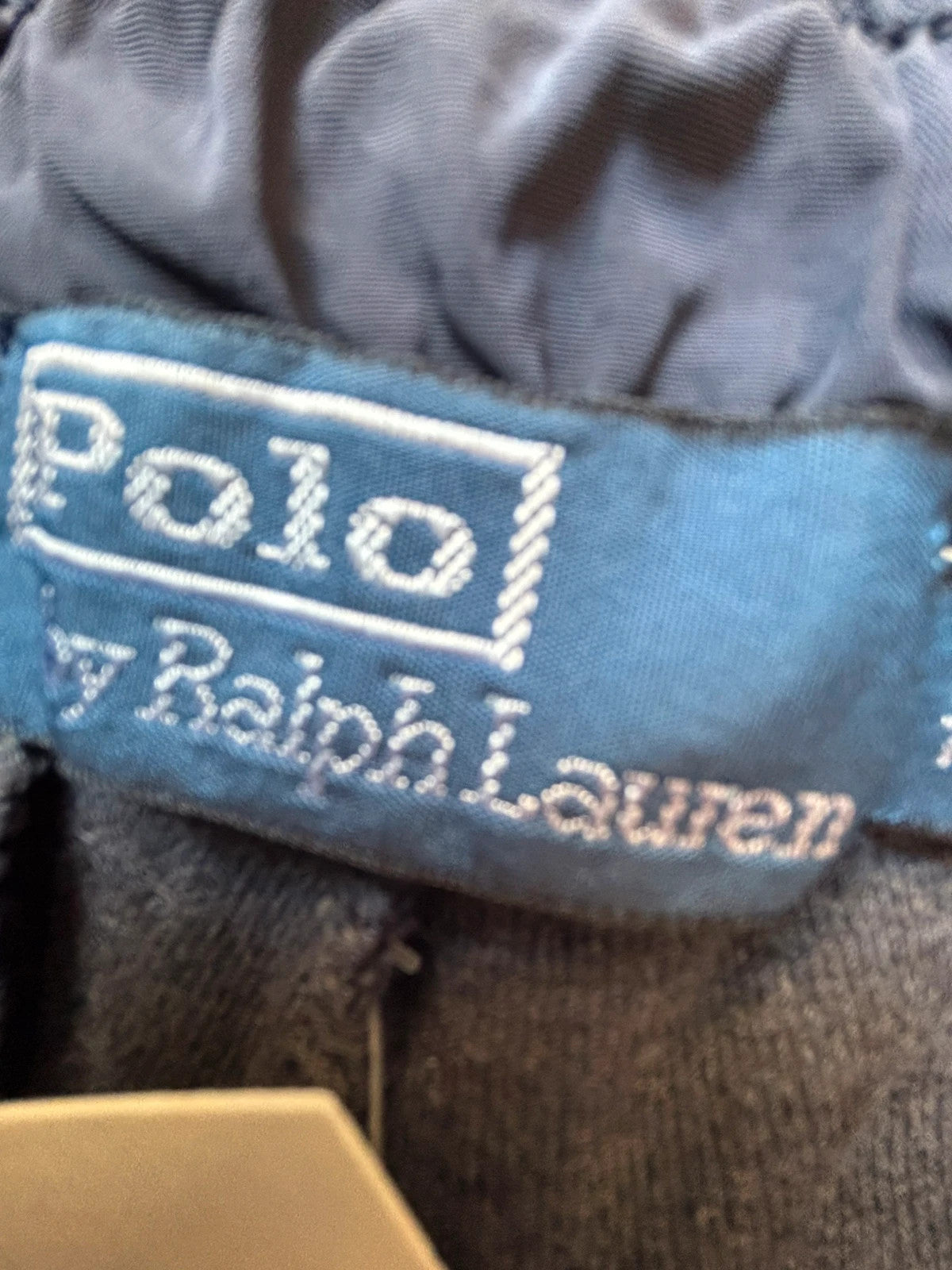 Polo Ralph Lauren navy joggers with embroidered Pony logo and side cargo pockets.
