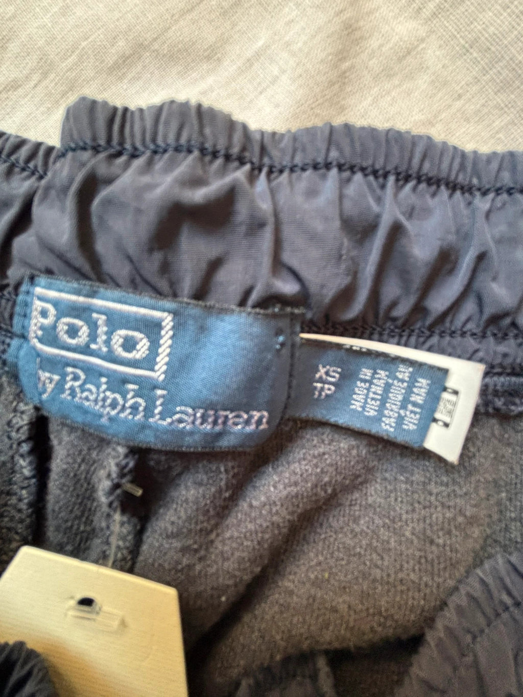 Polo Ralph Lauren navy joggers with embroidered Pony logo and side cargo pockets.