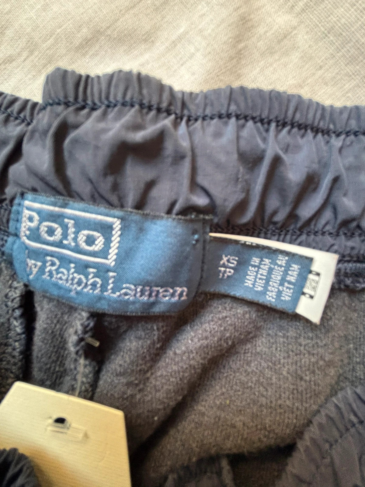 Polo Ralph Lauren navy joggers with embroidered Pony logo and side cargo pockets.