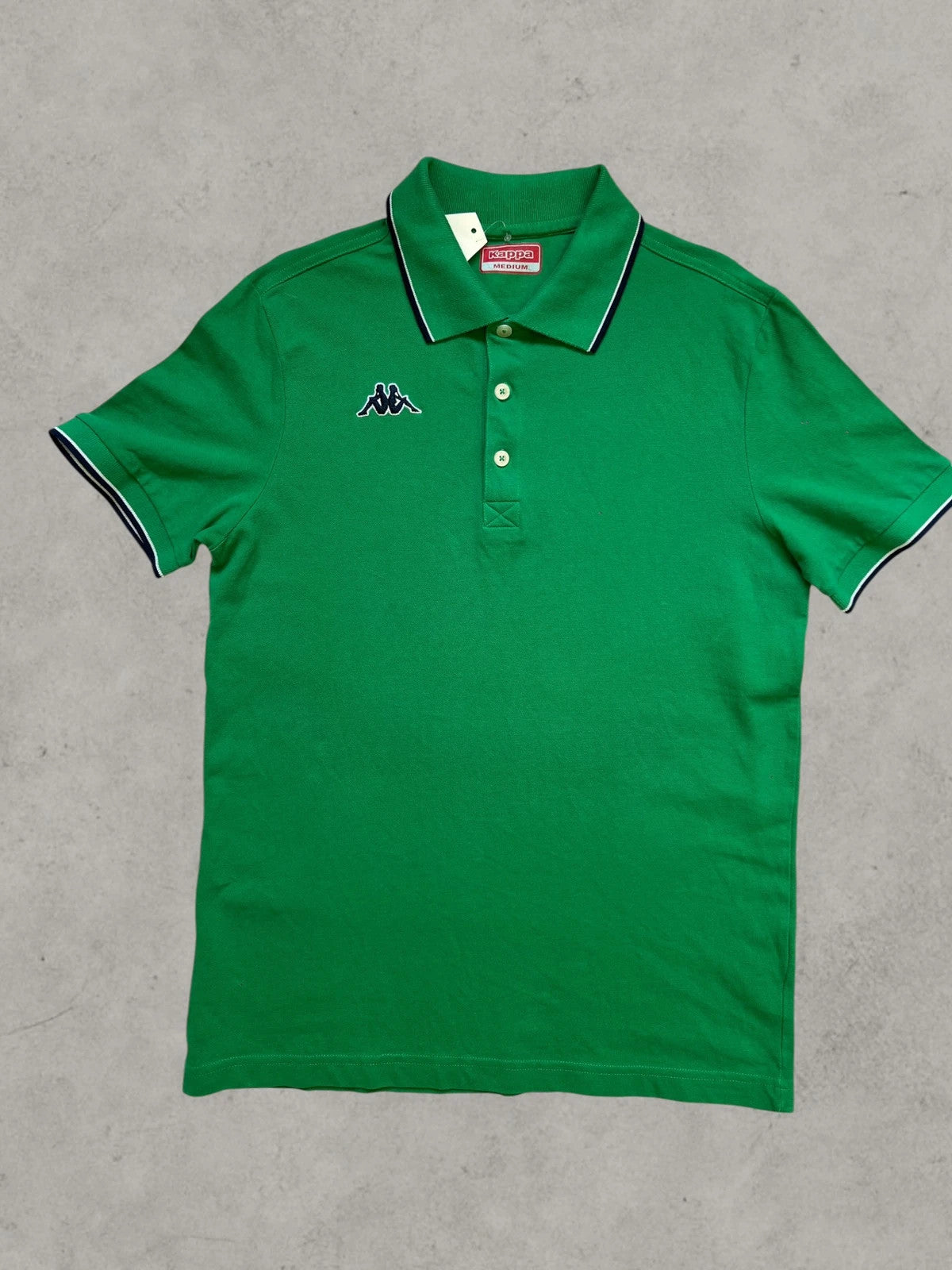 Kappa green polo shirt with embroidered logo and navy-white collar trim.