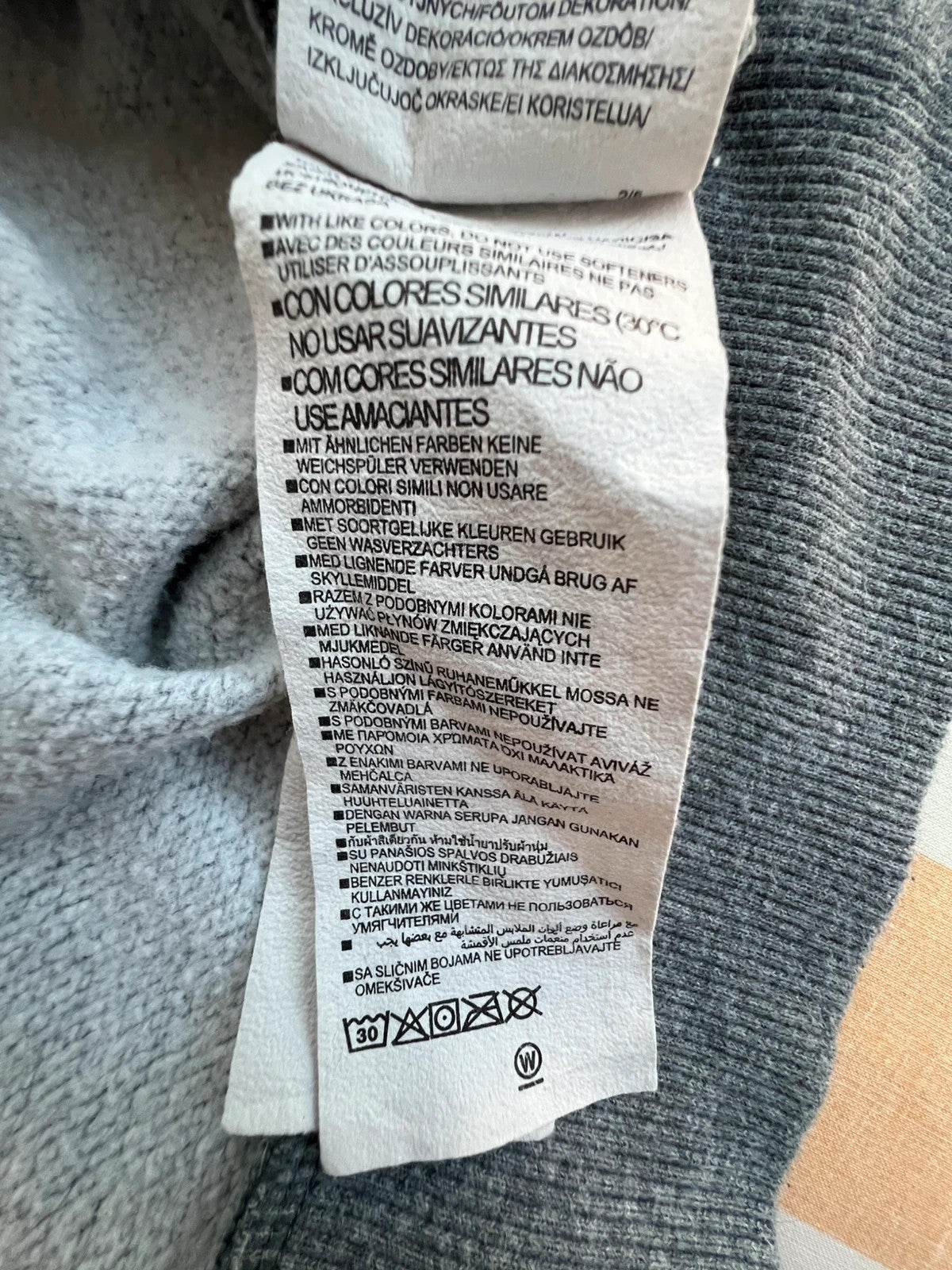 Under Armour grey oversized hoodie with front kangaroo pocket and logo on chest.