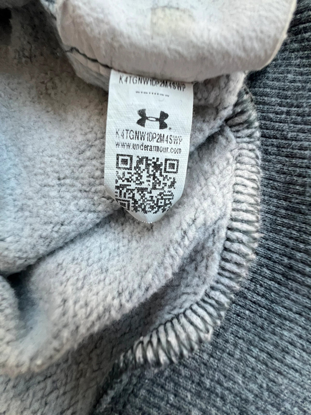 Under Armour grey oversized hoodie with front kangaroo pocket and logo on chest.