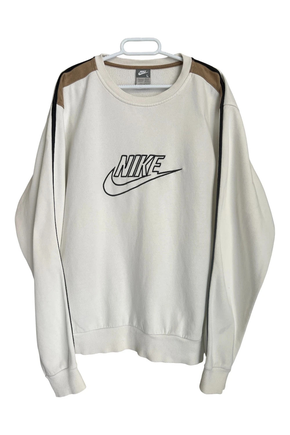Nike white sweatshirt with beige embroidered logo and fleece interior.
