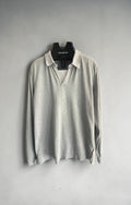 Hugo Boss grey long sleeve polo shirt with open collar and soft cotton fabric.