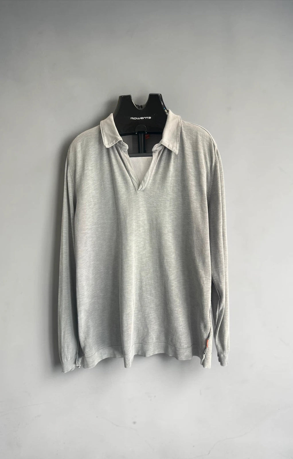 Hugo Boss grey long sleeve polo shirt with open collar and soft cotton fabric.